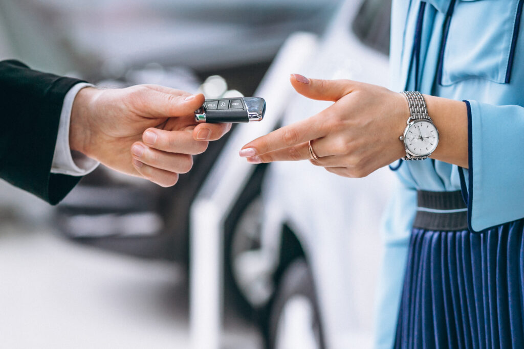 Car rental - Female hands close up with car keys